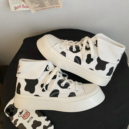 Zapatos de lona de caña alta para niñas con estampado de manchas de vaca