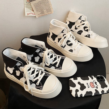 Zapatos de lona de caña alta para niñas con estampado de manchas de vaca