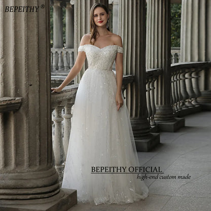 BEPEITHY Glittler Lace Vestidos de novia marfil para mujer 2023 Sin mangas Fuera del hombro Lujoso vestido de novia largo hasta el suelo