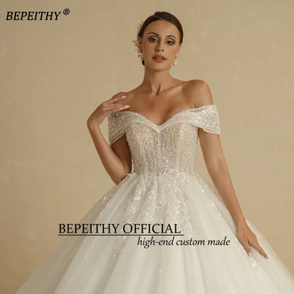 BEPEITHY Vestidos de novia de princesa con cuentas de marfil 2022 para novia sin hombros sin mangas para mujer Vestido de novia con bola de purpurina Batas