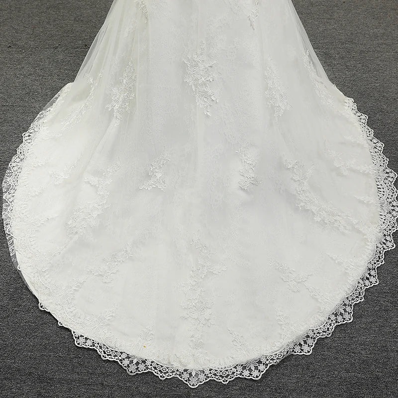 Robe de mariée sirène avec longue traîne en dentelle pour femmes, sans bretelles, coupe ajustée, décolleté en cœur, sans manches