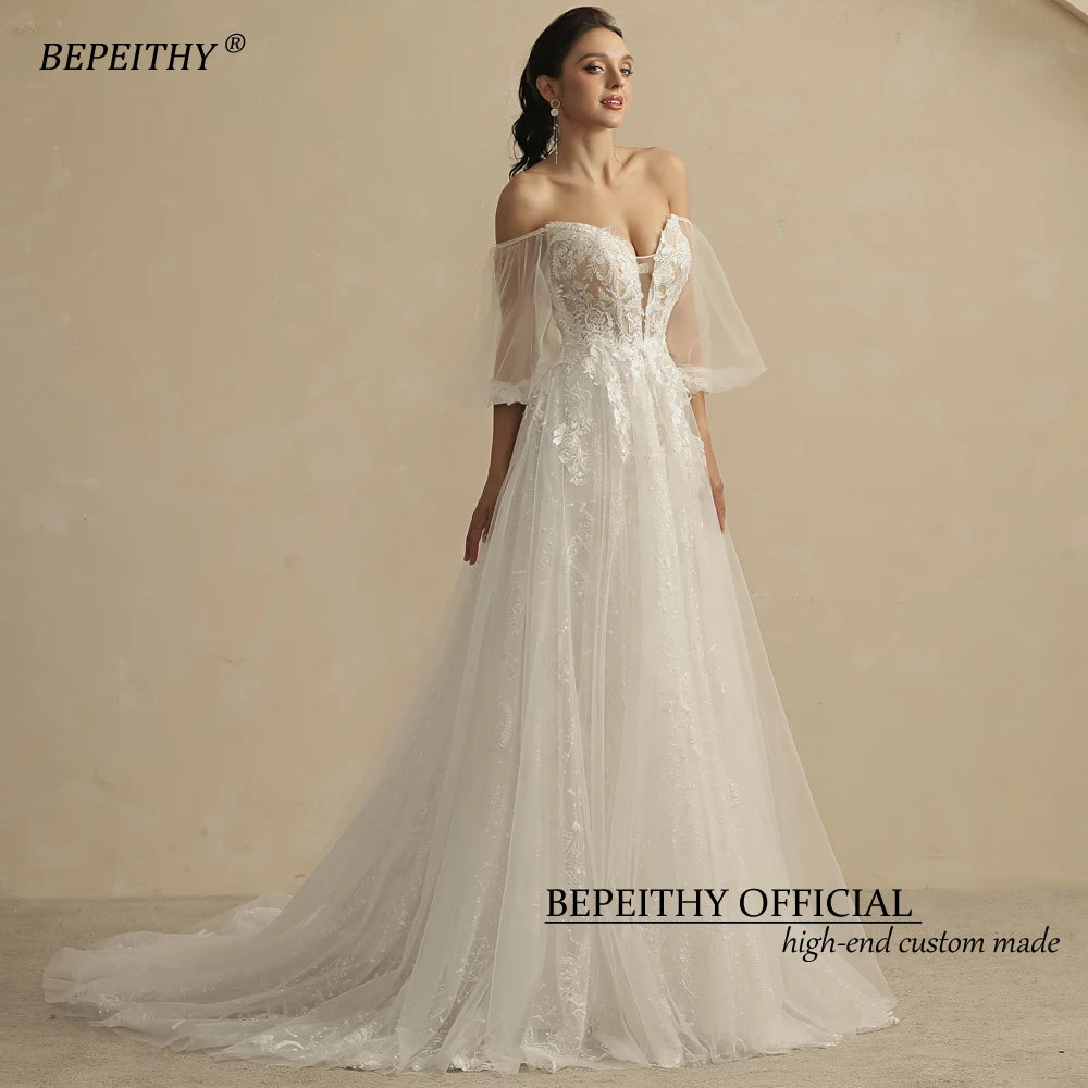 BEPEITHY Shinny Glittle A Line Skirt Ivory Robes de mariée pour femmes avec manches bouffantes Robe de mariée sexy en dentelle chérie 2022