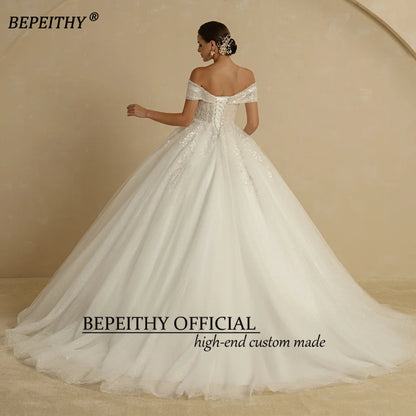 BEPEITHY Vestidos de novia de princesa con cuentas de marfil 2022 para novia sin hombros sin mangas para mujer Vestido de novia con bola de purpurina Batas