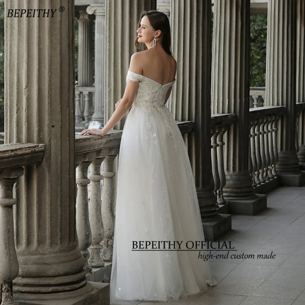 BEPEITHY Robe de mariée ivoire en dentelle scintillante pour femmes 2023 sans manches à épaules dénudées Robe de mariée de luxe longueur au sol