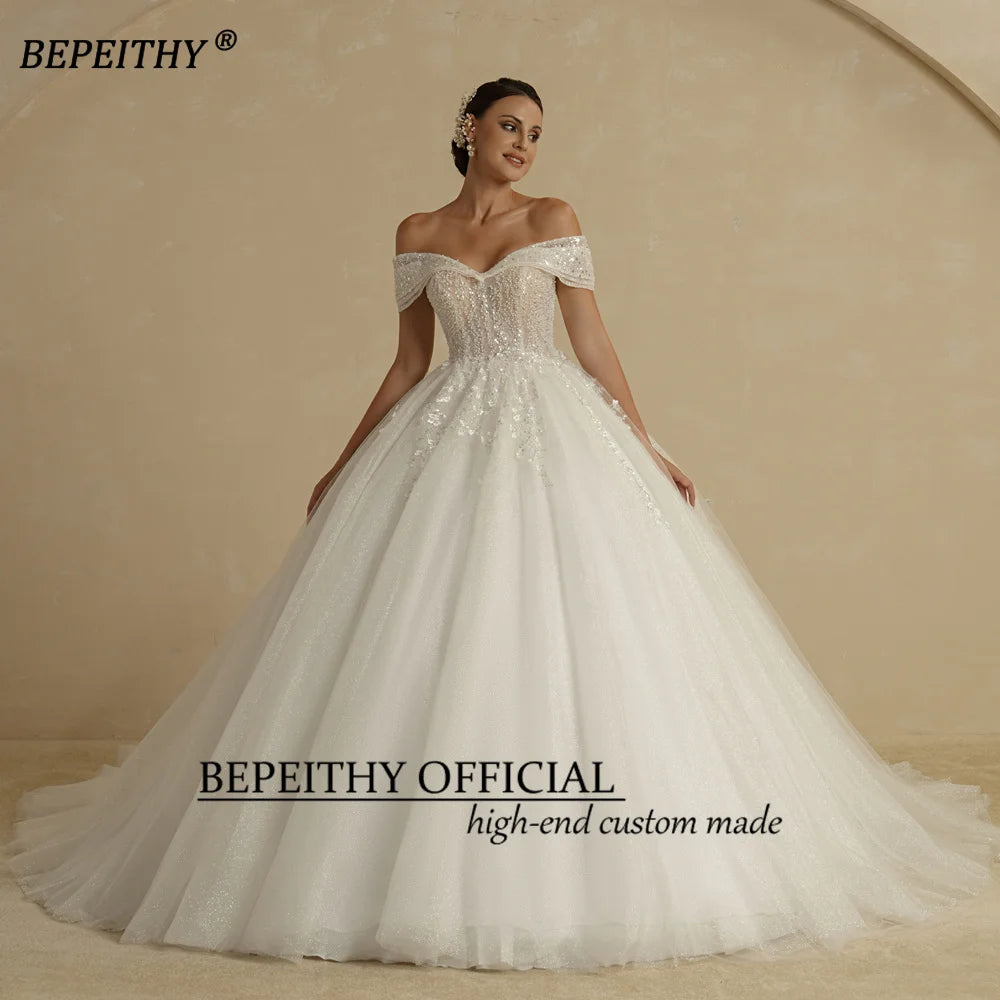 BEPEITHY Vestidos de novia de princesa con cuentas de marfil 2022 para novia sin hombros sin mangas para mujer Vestido de novia con bola de purpurina Batas