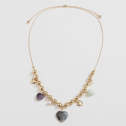 Collar de corazón bañado en oro con piedra natural